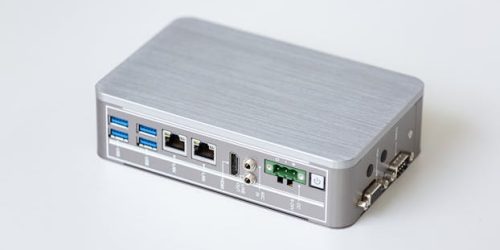 A silver network router with multiple USB ports, perfect for small offices.